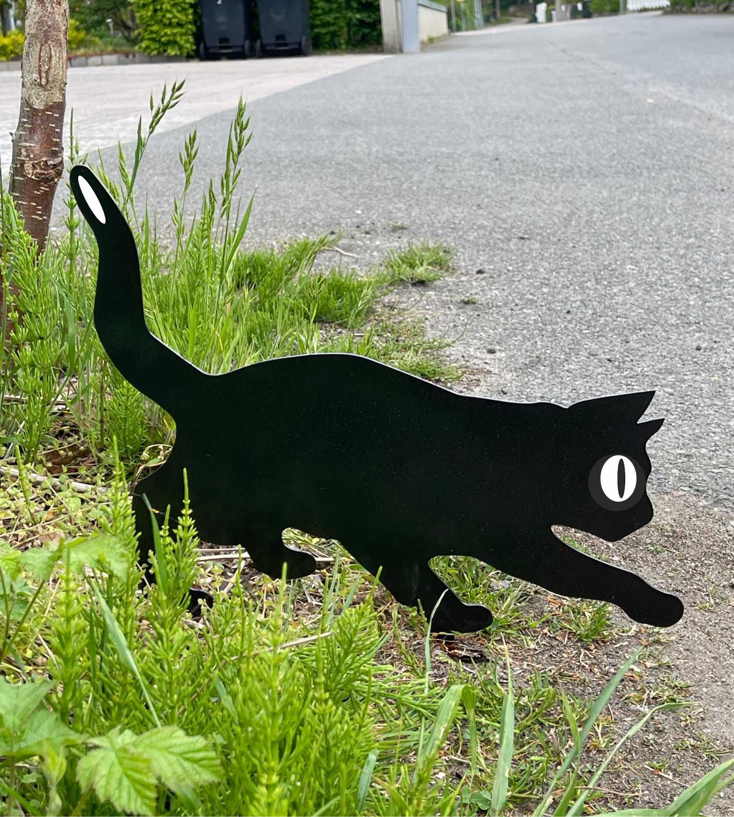 Reflexkatt i svartlackerat stål